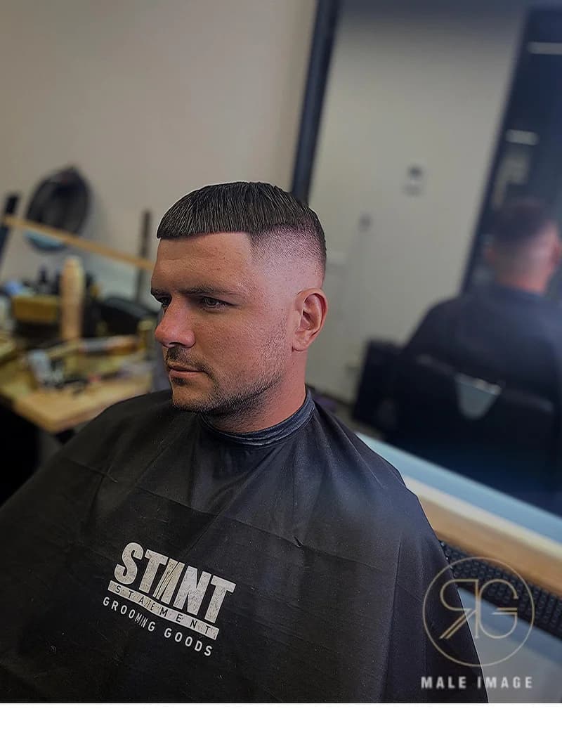 Men's short French crop haircut with skin fade