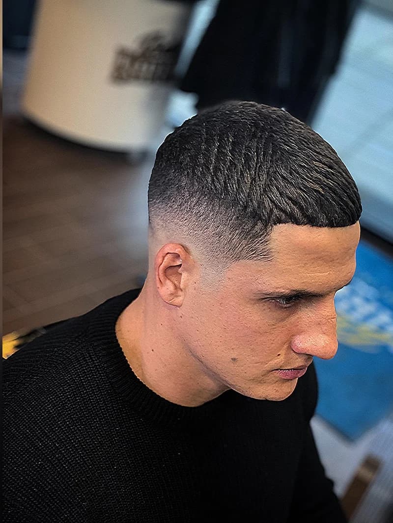 Short men's haircut with sharp fade